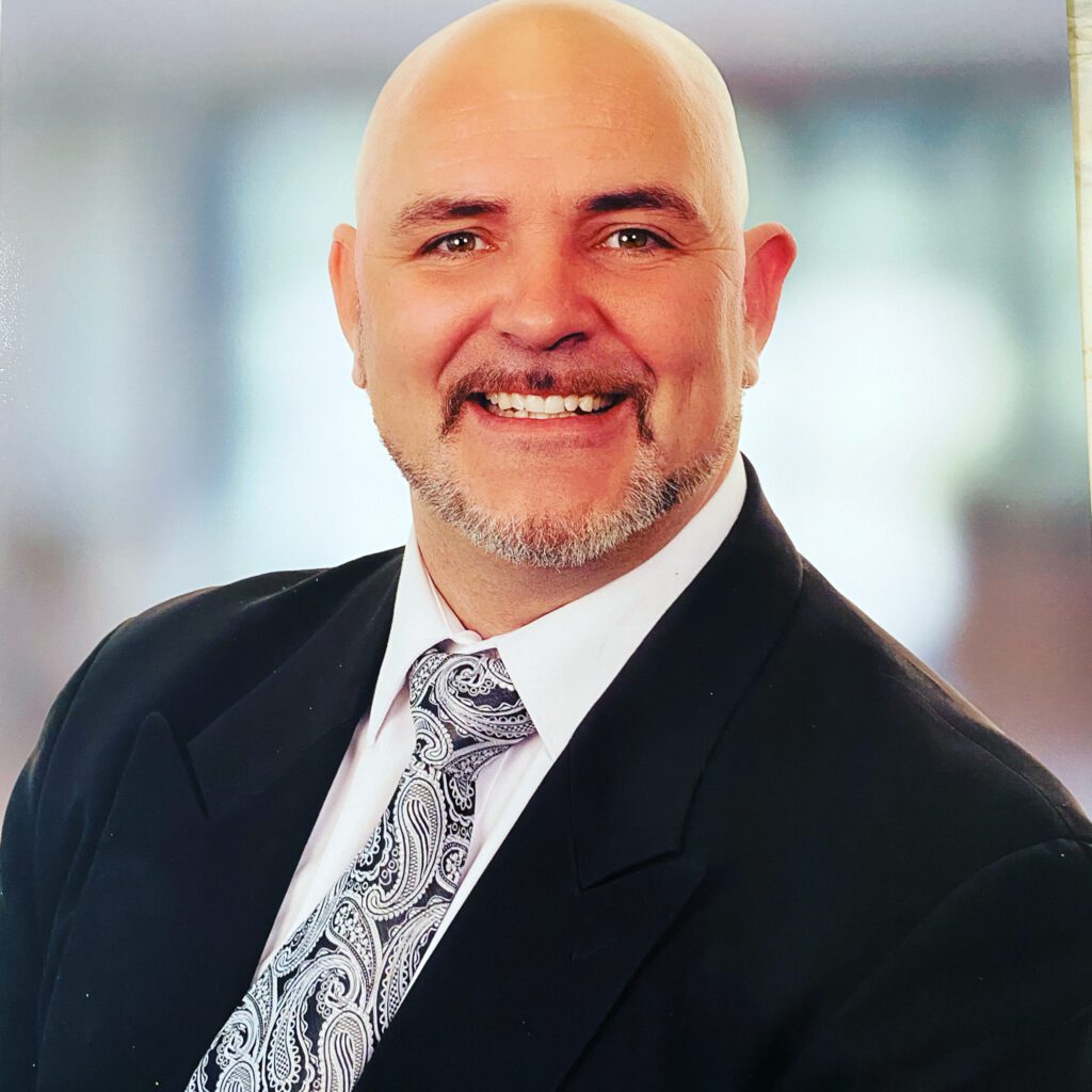 Shawn Crockett wearing a suit
